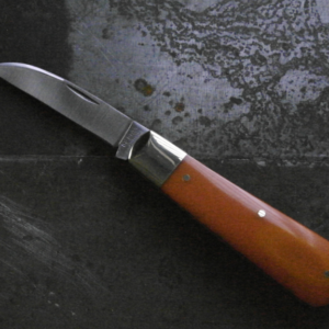 Orange Bakelite pocket knife with a sleek, vintage-inspired design, featuring a polished blade and smooth, vibrant orange handle